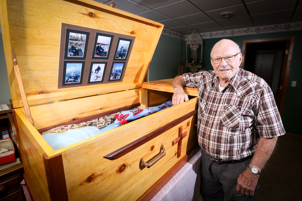 Ed Olsen and the wooden funeral casket he crafted